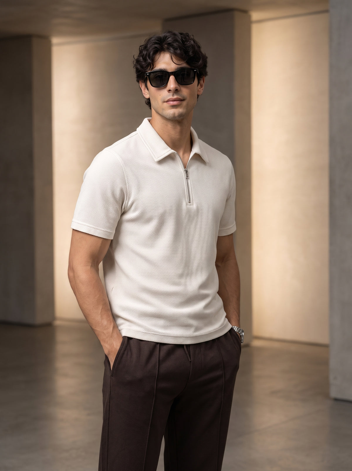 Man wearing a polo shirt and trousers